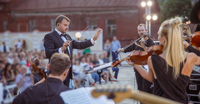Beethoven Festival- Violins and conductor play open air to a large crowd